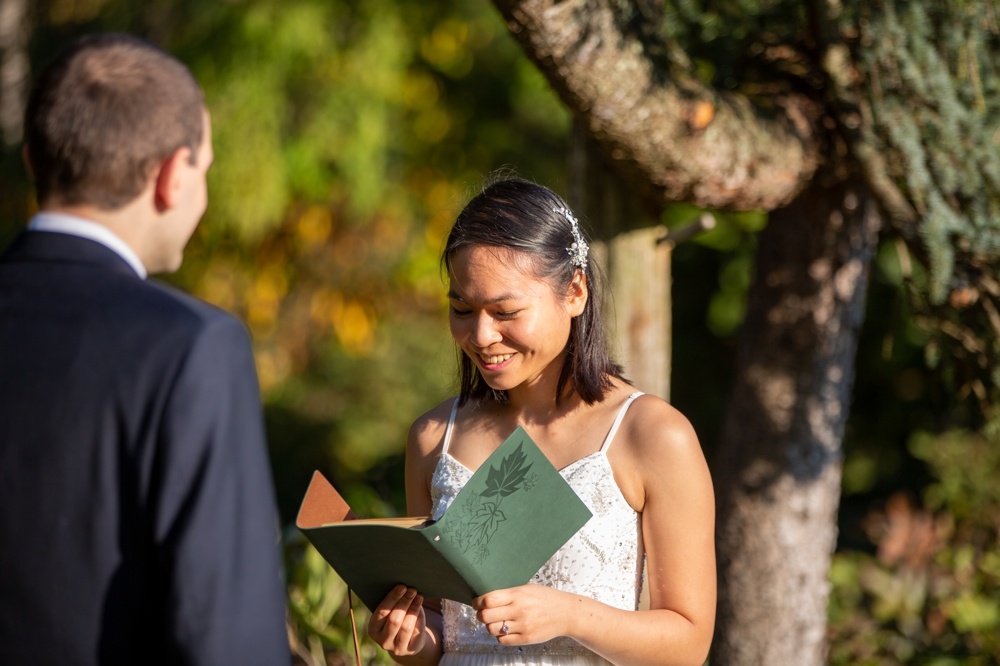 bride reading vows in elopement at elizabeth park