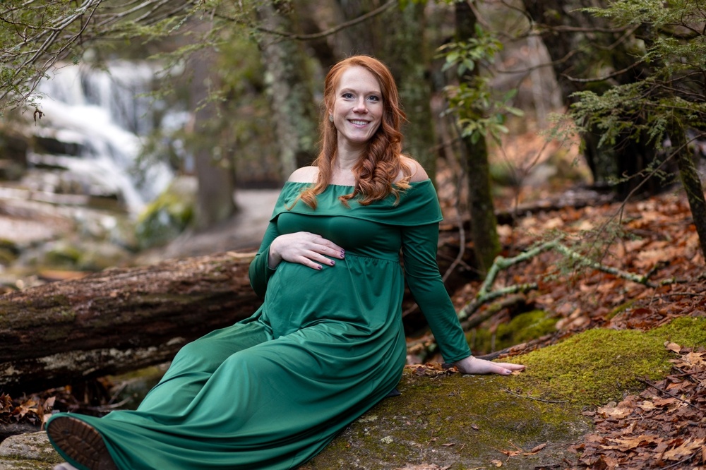 pregnant woman posing in front of enders falls